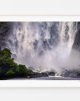 Bowen Falls cascading beside forest at Milford Sound, displayed in a white frame with a white mat.