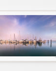 Yachts and reflections in calm water at Mana Marina, displayed in a white frame with a white mat.